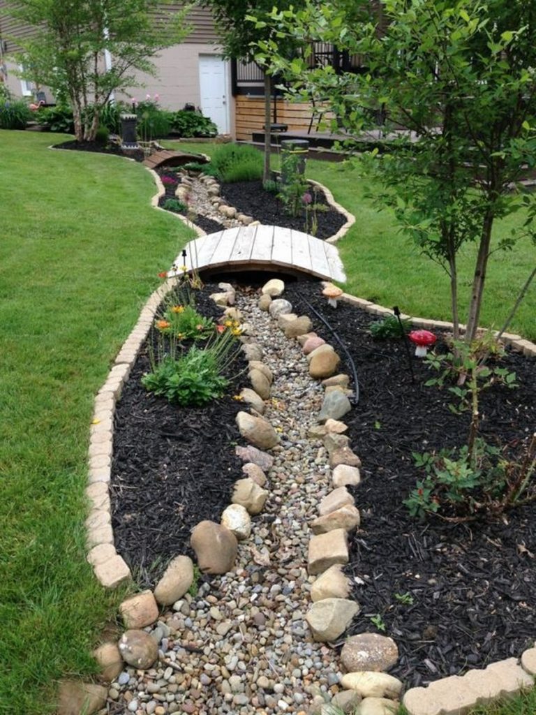 Decorating Garden With Rocks and Flowers