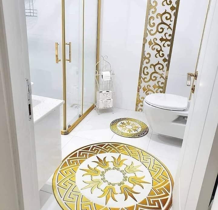 gold and white bathroom